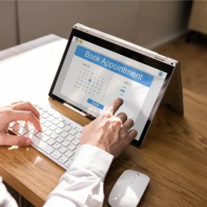 Business owner managing appointments on digital calendar