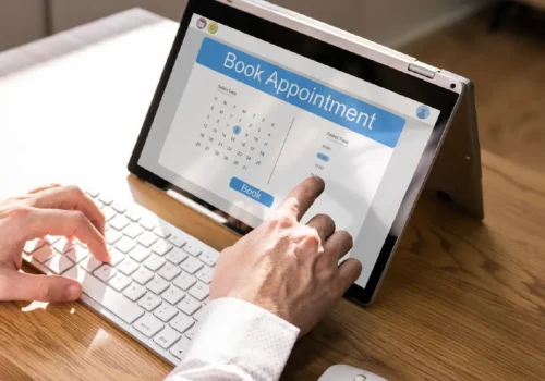 Business owner managing appointments on digital calendar