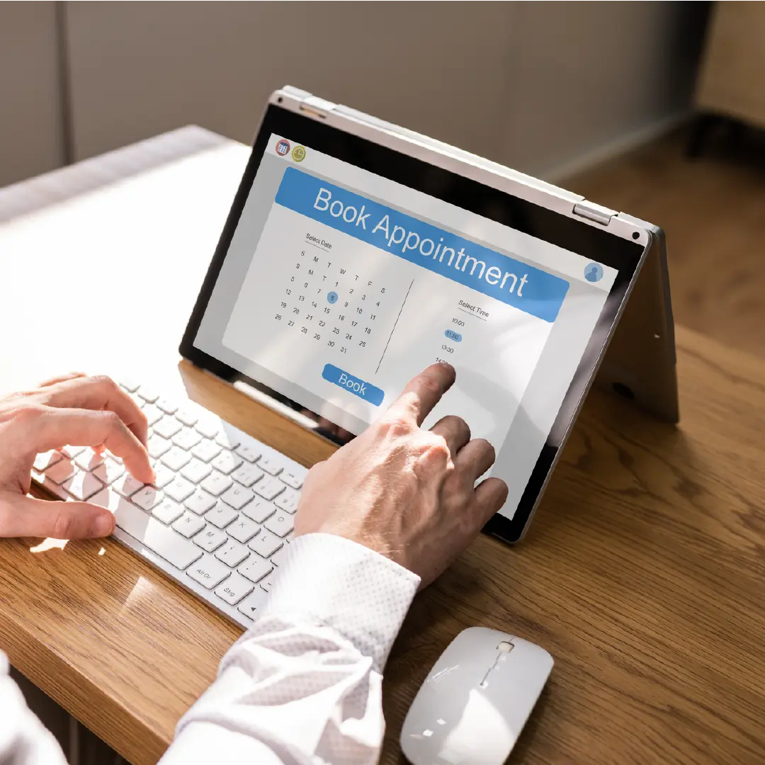 Business owner managing appointments on digital calendar