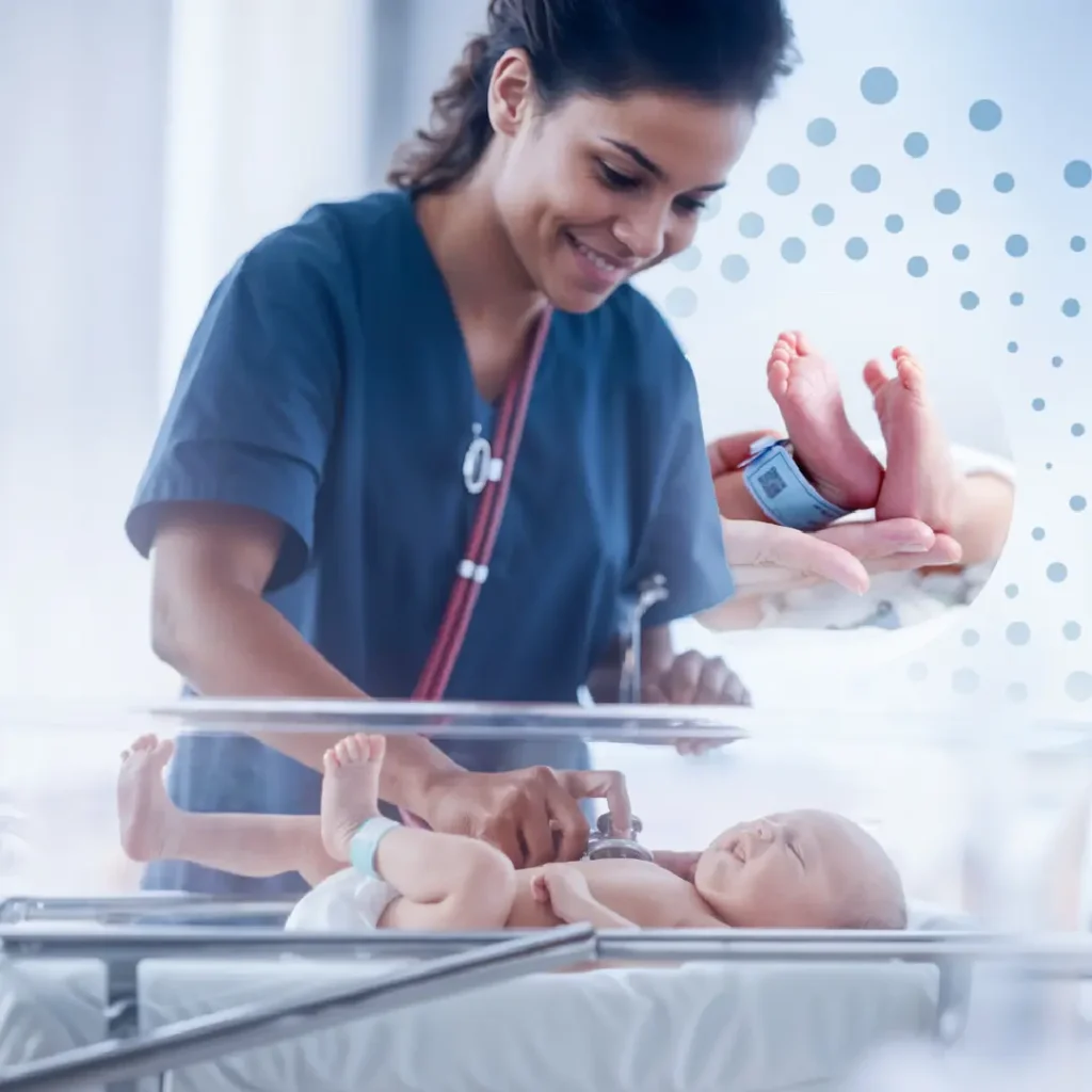 Nurse applying RFID tag to newborn in hospital ward