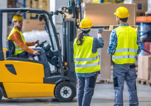 Worker scanning assets in warehouse with RFID device