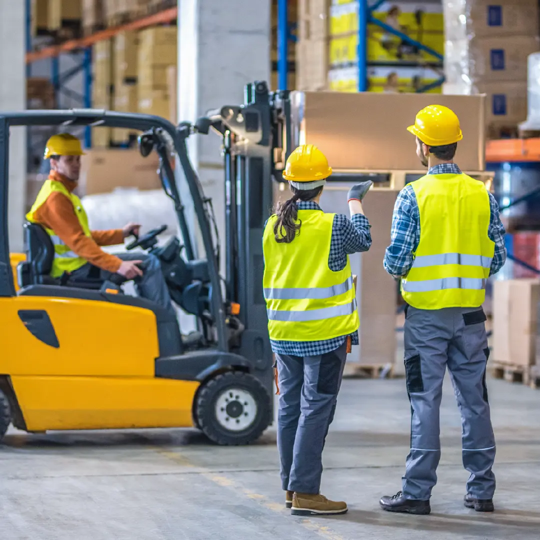 Worker scanning assets in warehouse with RFID device